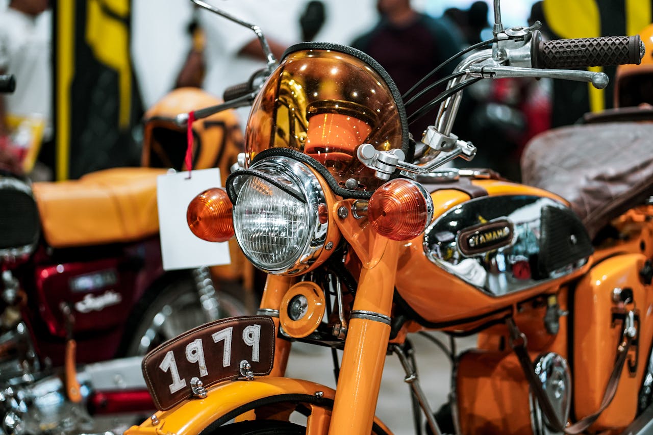why-choose-us Detailed view of a classic 1979 Yamaha motorcycle at an exhibition.